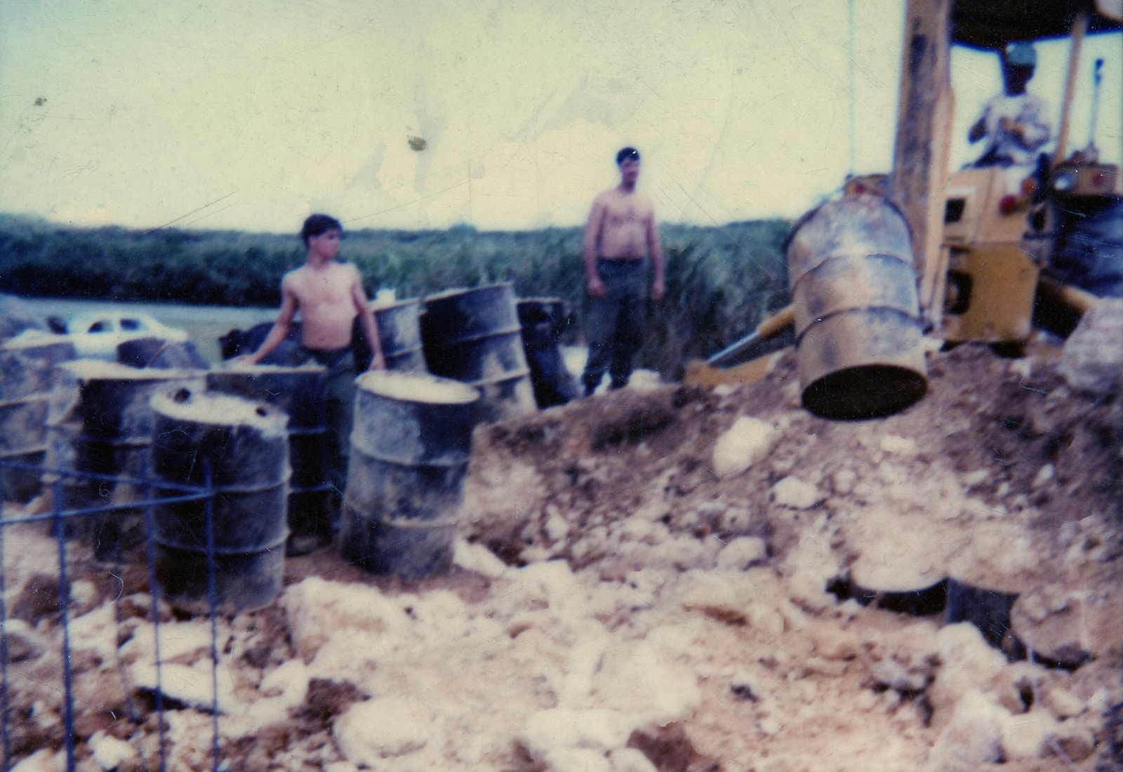 Japanese soldiers move Agent Orange barrels on Okinawa. Credit: The Japanese Times.